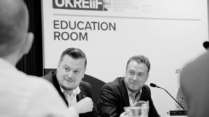 Christopher Chave-Cox and Toby Taylor of iwGROUP talking at UKREiiF
